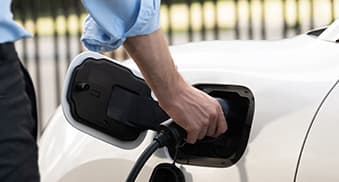 Charging cable being connected to an electric vehicle charge port